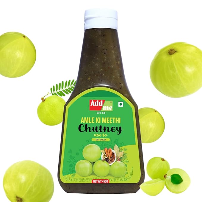 Bottle of Add Me Amla Ki Meethi Chutney with gooseberries on a white background