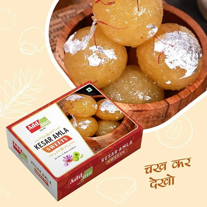 Kesar Amla sweets in a wooden bowl with a box of the product on a beige background. kesar amla murabba