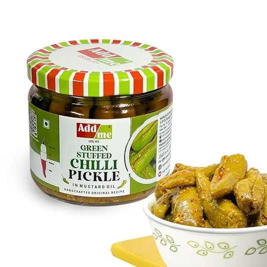 Jar of Addme green stuffed chilli pickle with a bowl of pickles on a white background