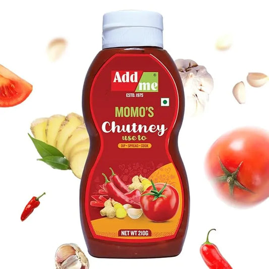 Bottle of Add Me Momo's Chutney with ingredients like tomatoes and ginger on a white background