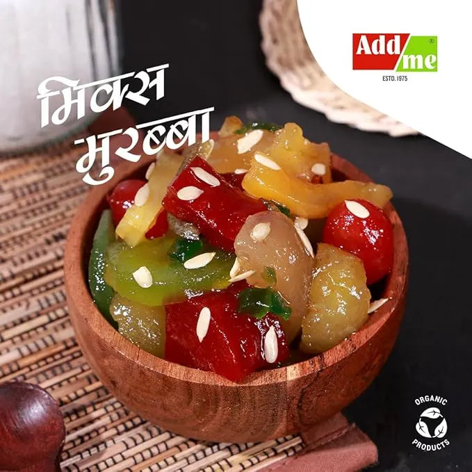 Add Me Foods: Wooden bowl filled with colorful pickled vegetables on a woven mat, with 'Addme' brand logo in the corner. mix murabba