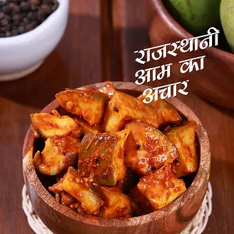 Wooden bowl of Rajasthani food with text overlay on a wooden background