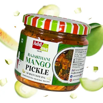 Jar of Adda's Rajasthani Mango Pickle with a colorful lid on a green background