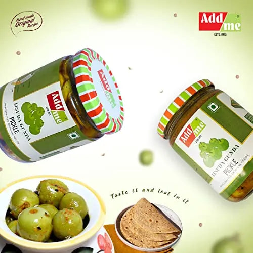 Two jars of Add Me Indian Green Pickle with a bowl of pickles and tortilla chips on a light green background.