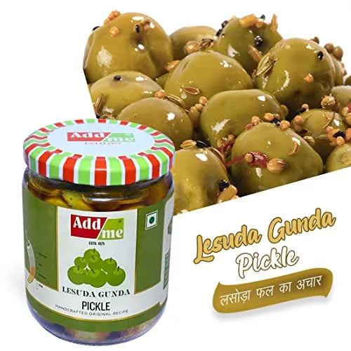 Jar of Add Me Lesuda Gunda Pickle with green olives in the background
