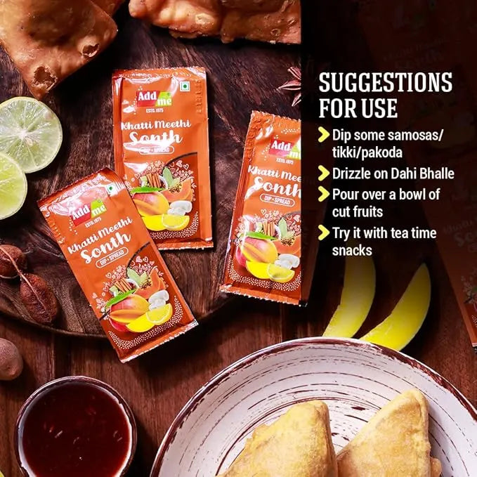 Three packets of 'Khatti Meethi Sonth' on a wooden surface with suggestions for use displayed.