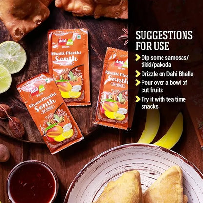 Three packets of 'Khatti Meethi Sonth' on a wooden surface with suggestions for use displayed.