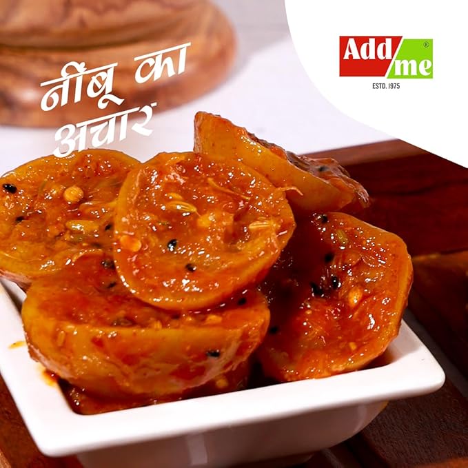 Sliced pickled tomatoes in a white bowl with 'Add Me' logo in the corner.