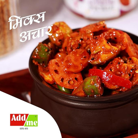 Spicy dish with lotus stems and green peppers in a brown bowl, with 'Add Me' branding.