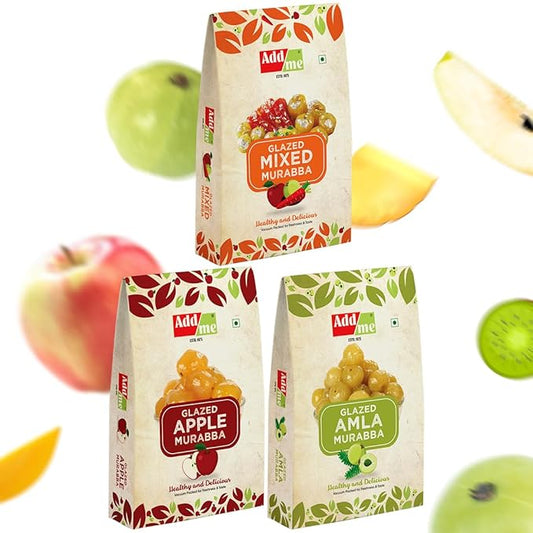 Three packages of Add Me Glazed Mixed Murabba, Glazed Apple Murabba, and Glazed Amla Murabba with fruits in the background.