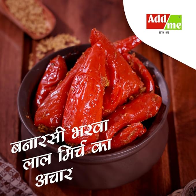 Bowl of red chili peppers with a brand logo in the corner on a wooden background