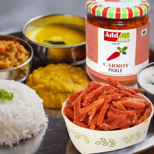 Carrot pickle in a bowl with a jar of Add Me carrot pickle in the background.