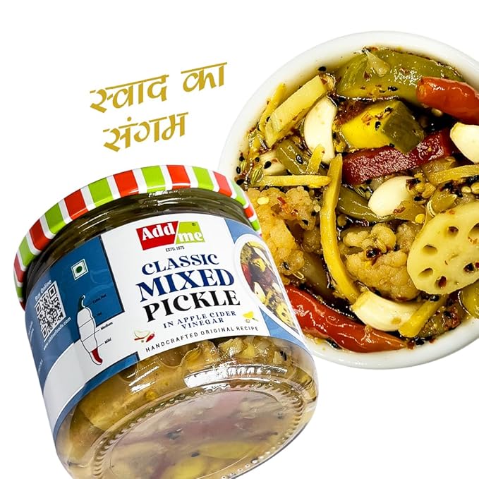 Jar of Add Me Classic Mixed Pickle with a bowl of pickles on a white background