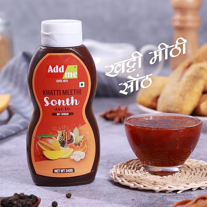Add Me Foods: Bottle of Add Me Khatti Meethi Sonth with a bowl of sonth on a table.