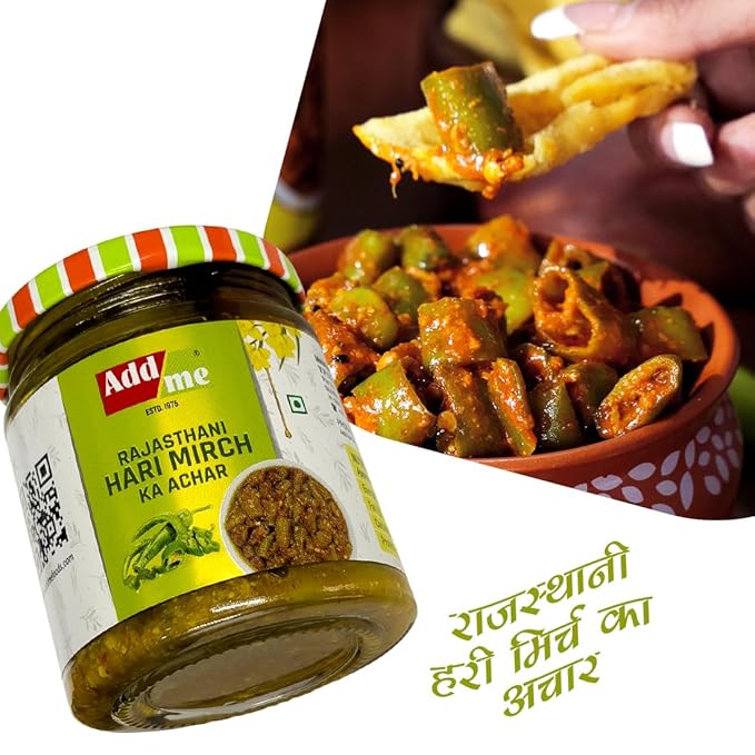 Jar of Addme Rajasthani Hari Mirch Ka Achar with okra dish in the background