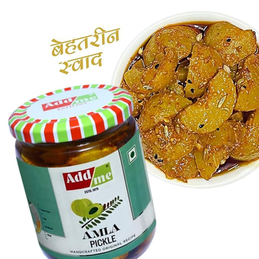 Jar of Add Me amla pickle with a plate of pickled amla slices on a white background
