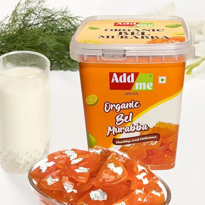 Add Me Foods: Container of Add Me Organic Bel Murabba with a glass of milk and more murabba on a white background.
