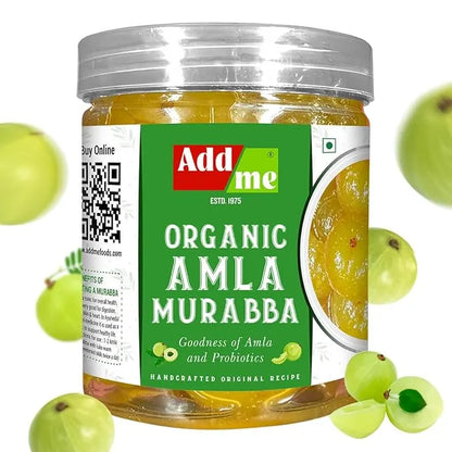 Add Me Foods: Jar of Add Me Organic Amla Murabba with a green label and a silver lid, surrounded by gooseberries on a white background.