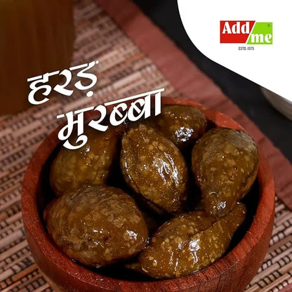 Add Me Foods: Wooden bowl filled with brown gummy bears on a textured surface, with 'Add Me' branding. Harad Murabba