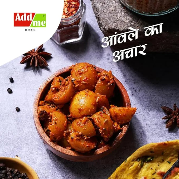 Wooden bowl of potato dish with spices and 'Add Me' branding on a gray surface. Seedless Amla Pickle 