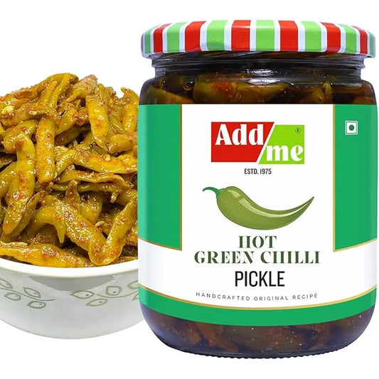 Jar of Add Me hot green chili pickle with a bowl of pickles on a white background