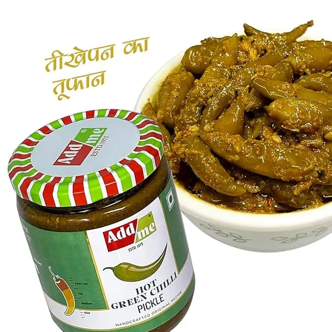 Jar of Add Me hot green chilli pickle with a bowl of pickled green chilies on a white background.
