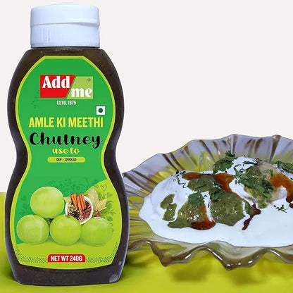 Bottle of Add Me Amle Ki Meethi Chutney with a plate of chutney and food.