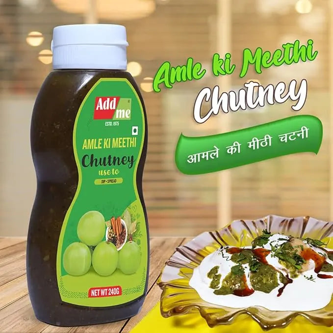 Bottle of Addme Amle Ki Meethi Chutney with a plate of food in the background