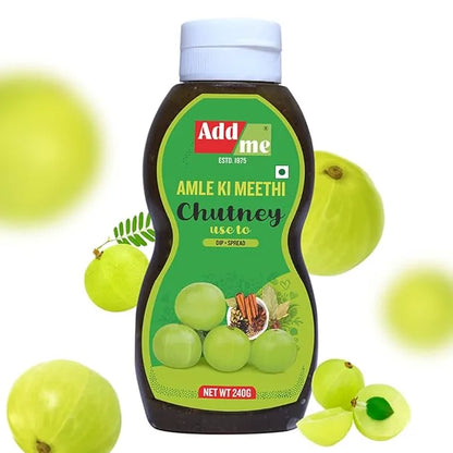 Bottle of Add Me Amla Ki Meethi Chutney with a green label and a white cap, surrounded by gooseberries on a white background.