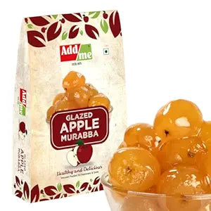 Add Me Foods: Add Me Glazed Apple Murabba packaging with a bowl of fruit in the foreground on a white background