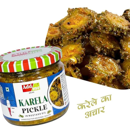 Jar of Add Me Karela Pickle with okra dish in the background