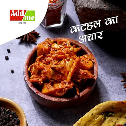 Wooden bowl of a spicy dish with spices and Addme logo on a dark background
