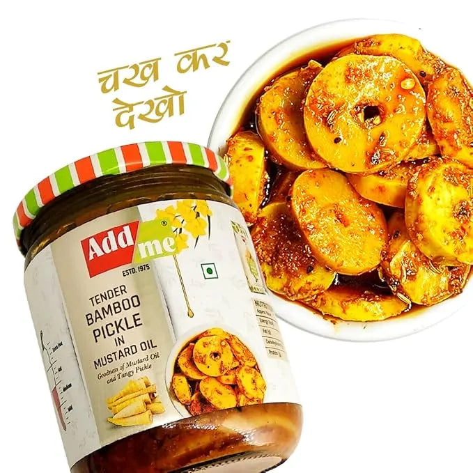 Jar of Addme Tender Bamboo Pickle in Mustard Oil with a bowl of pickled bamboo shoots on a white background.