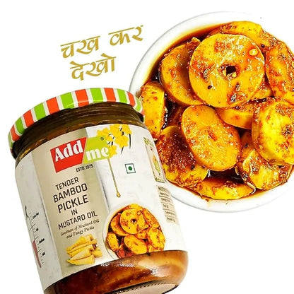 Jar of Addme Tender Bamboo Pickle in Mustard Oil with a bowl of pickled bamboo shoots on a white background.