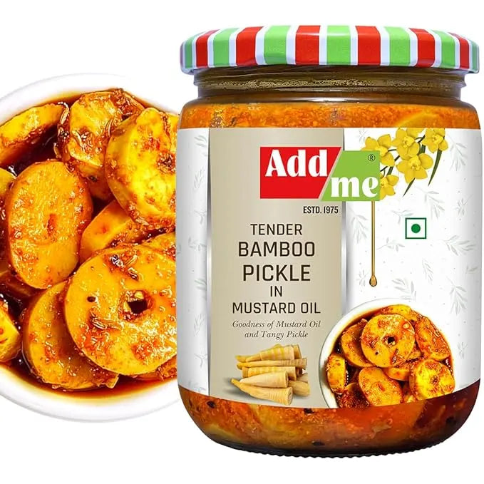 Jar of Add Me Tender Bamboo Pickle in Mustard Oil with a bowl of pickles on a white background