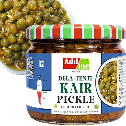 Jar of Dela-Tenti Kair Pickle with a colorful lid on a white background