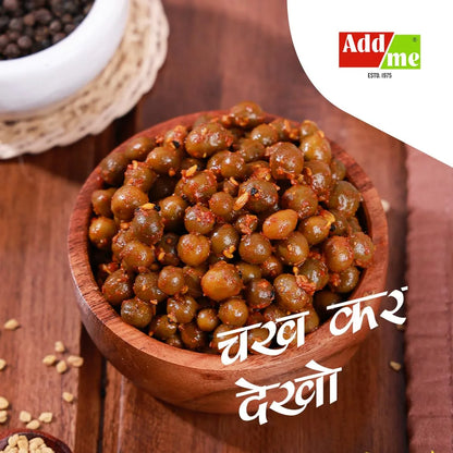 Wooden bowl filled with green lentils on a wooden surface, with 'Addme' logo in the corner.