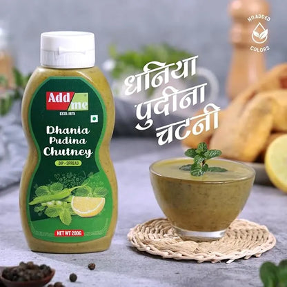 Add Me Foods: Addme Dhania Pudina Chutney bottle with a bowl of chutney on a textured surface.