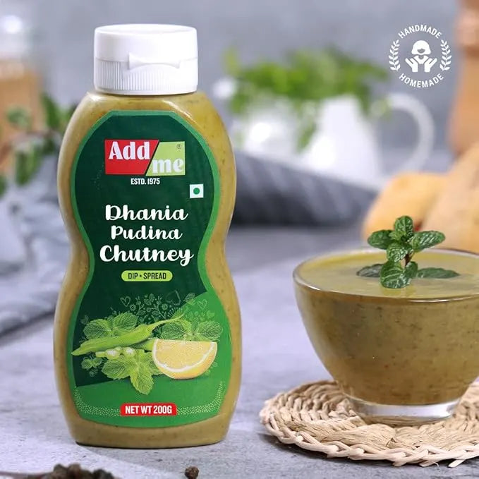 Add some Dhania Pudina Chutney bottle with a bowl of chutney on a table.