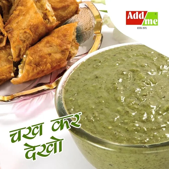 Bowl of green chutney with fried samosas on a white background, featuring the brand 'Add Me'.