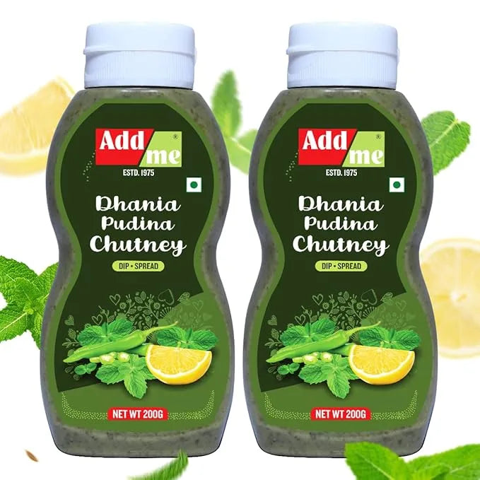 Two bottles of Add Me Dhania Pudina Chutney with lemon and mint leaves on a white background.