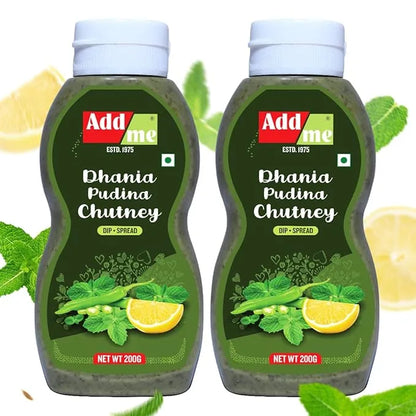 Two bottles of Add Me Dhania Pudina Chutney with lemon and mint leaves on a white background.