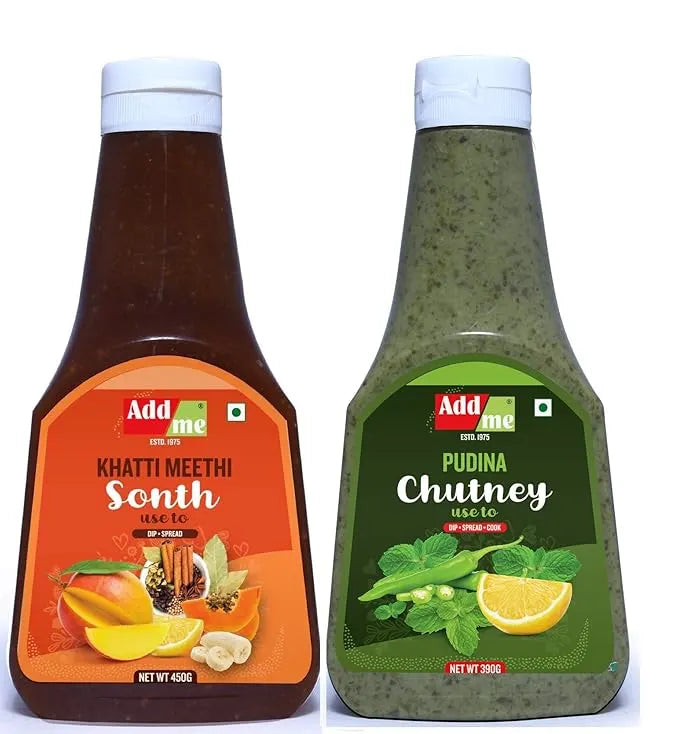 Add Me Foods: Two bottles of Add Me sauces, one orange and one green, on a white background.