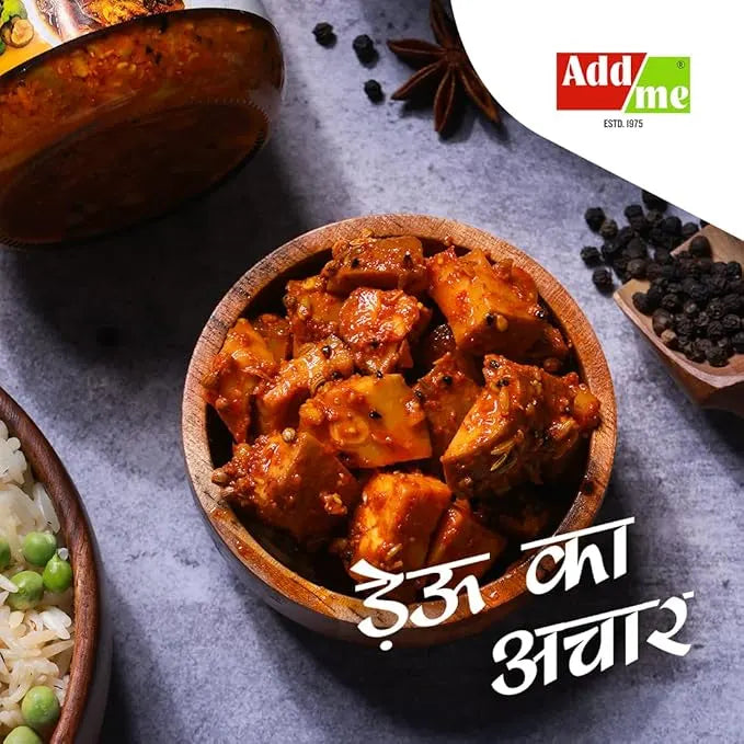 Bowl of curry with rice and peas on a gray surface, featuring Addme logo.