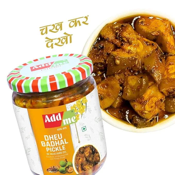 Jar of Add Me Dheu Badhal Pickle with a bowl of pickled vegetables on a white background