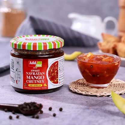 Jar of Add Me Sweet Navratan Mango Chutney with a bowl of chutney on a table, mango chutney