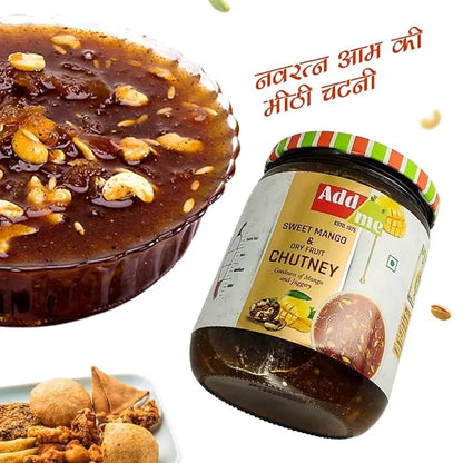 Jar of Add Some Sweet Mango Dry Fruit Chutney with a dessert and snacks on a white background