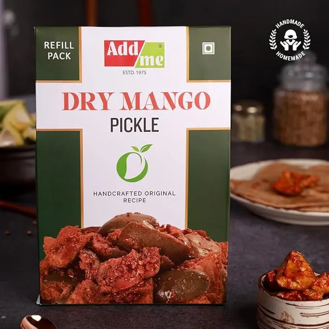 Addme Dry Mango Pickle packaging with ingredients in the background