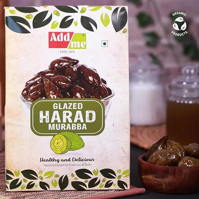 Add Me Foods: Packaging of Add Me Glazed Harad Murabba with a bowl of dried fruits in the background.