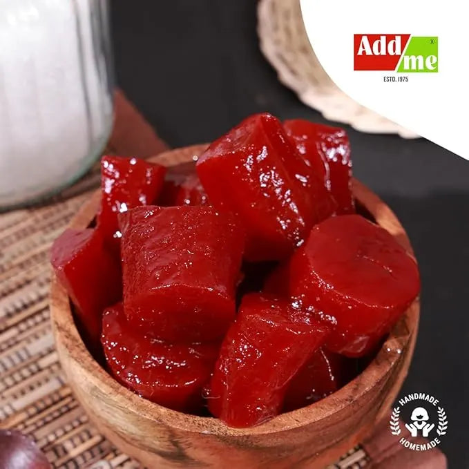 Add Me Foods: Wooden bowl filled with red gummy bears on a woven mat, with 'Add2me' brand logo in the corner.